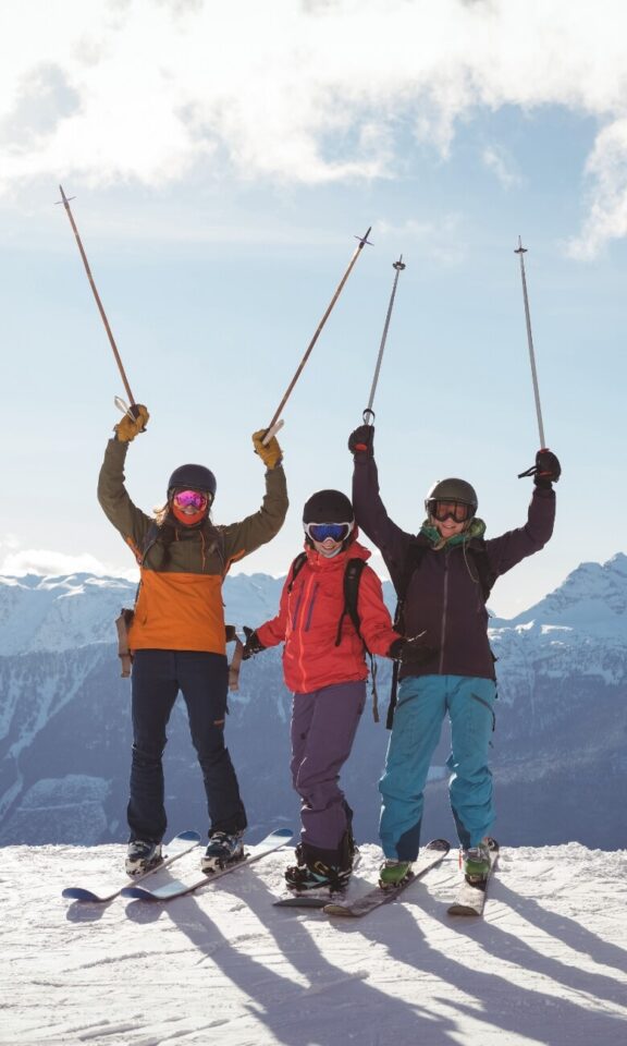 sportgardena-celebrating-skiers-standing-snow-covered-mountain-mobile