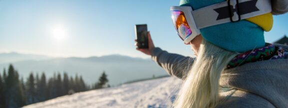 sportgardena-woman-skier-slope-mountains